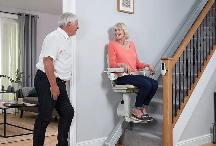 Senior using stairlift safely