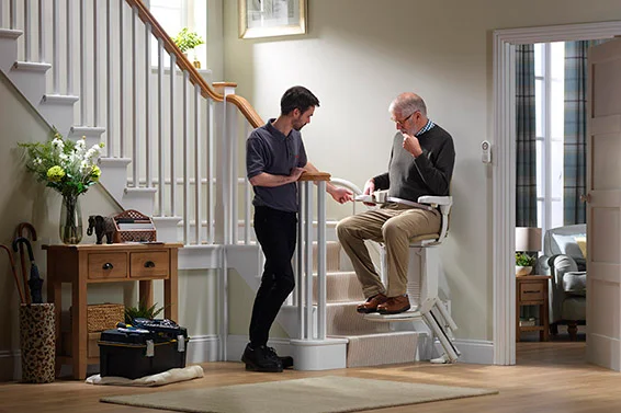 Stairlift engineer carrying out a repair and service visit